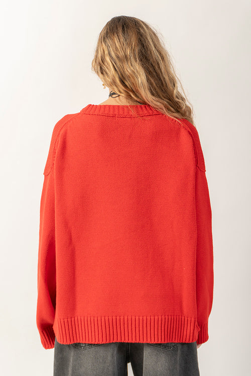 Roter Pullover mit gebrochenem Herzen